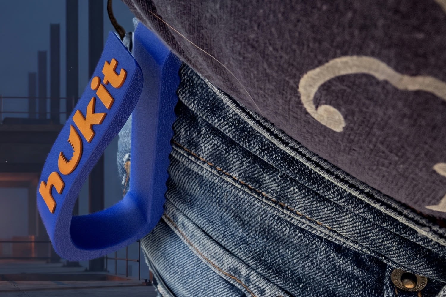 HUKIT clipped onto the top edge of a denim waistband